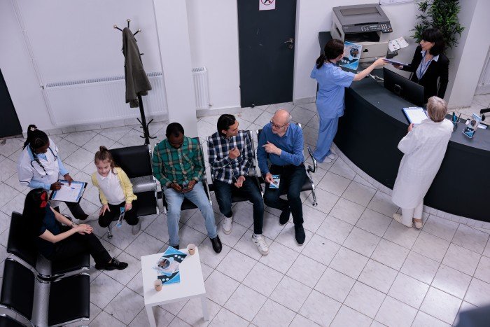 Patients and healthcare staff at a multispeciality hospital reception